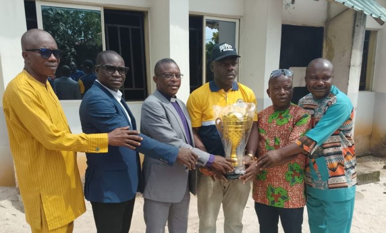 Journalist gives trophy for church football tournament
